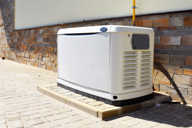 An image of a white generator outside