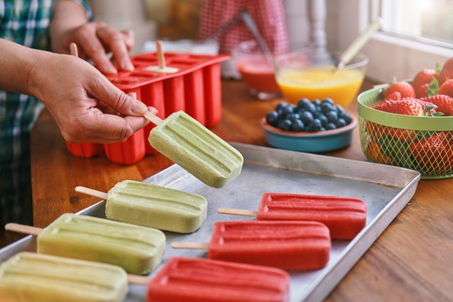 An image of popsicles on a tray in a kitchen