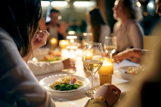 An image of people eating dinner at a restaurant