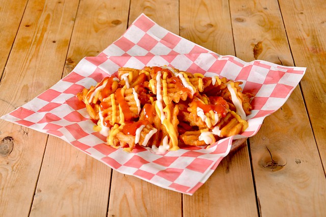 An image of a basket of waffle fries