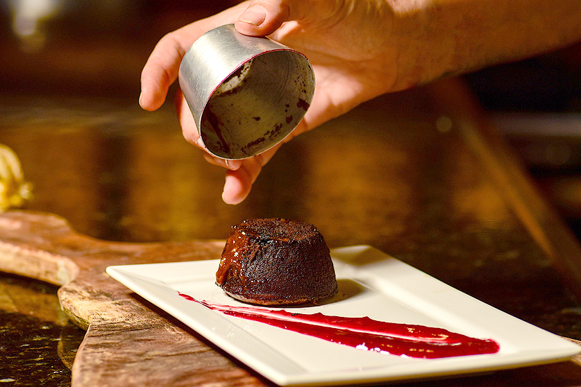 An image of a lava cake on a white plate