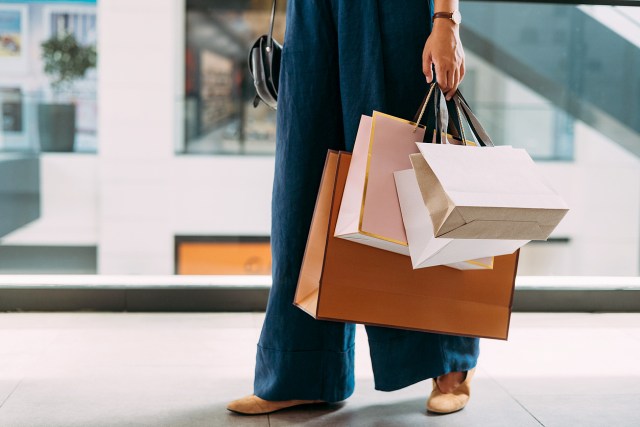 An image of a woman holding shopping bags
