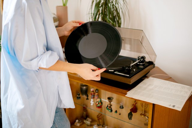 An image of a woman holding a record