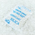 Silica packet with blue writing that reads "Throw away do not eat"