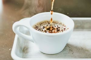 Coffee pouring into a white mug
