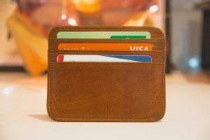 Credit card wallet with three credit cards in it