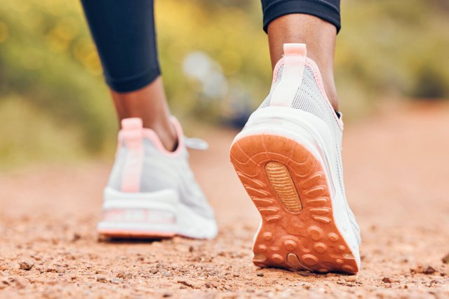 Shot of someone wearing athletic sneakers walking