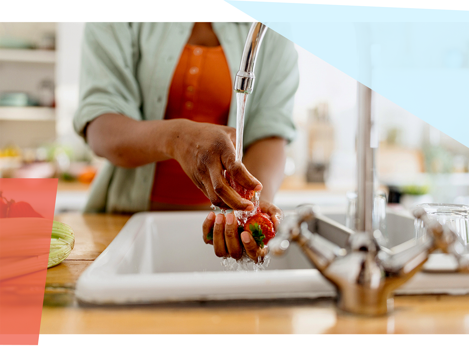 Person washing produce under running water 