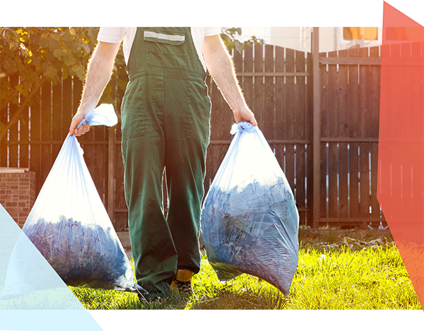 Person carrying a garbage bag in each hand 