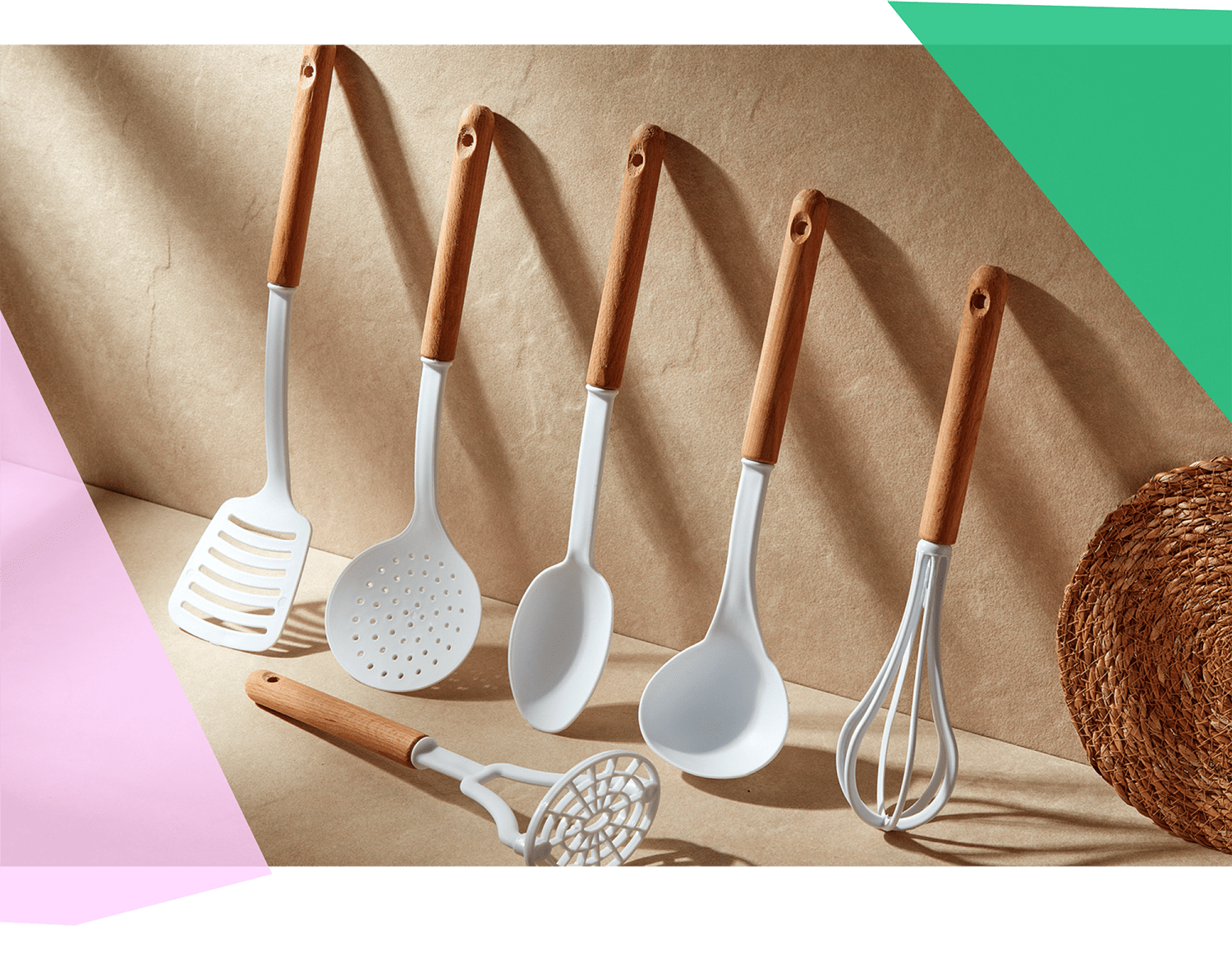 A collection of kitchen tools in white and wood 