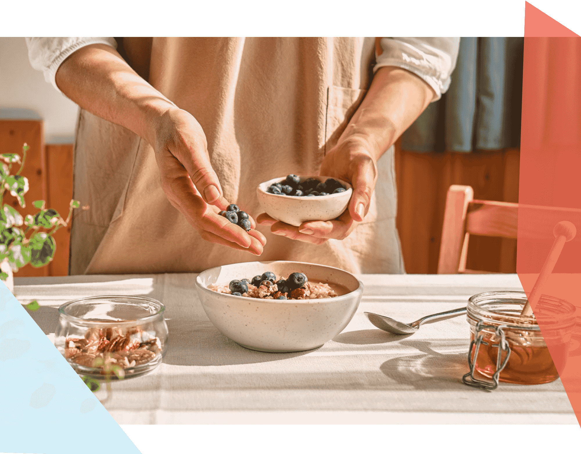 Person putting blueberries on bowl of oatmeal 