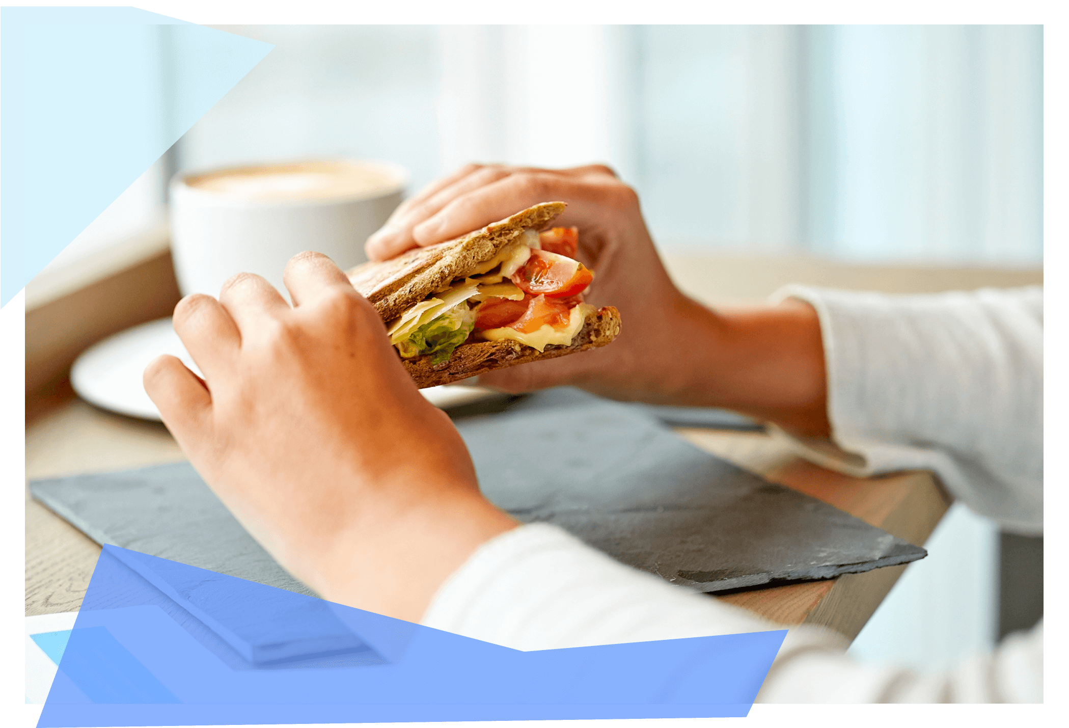 Person holding a sandwich between two hands. 