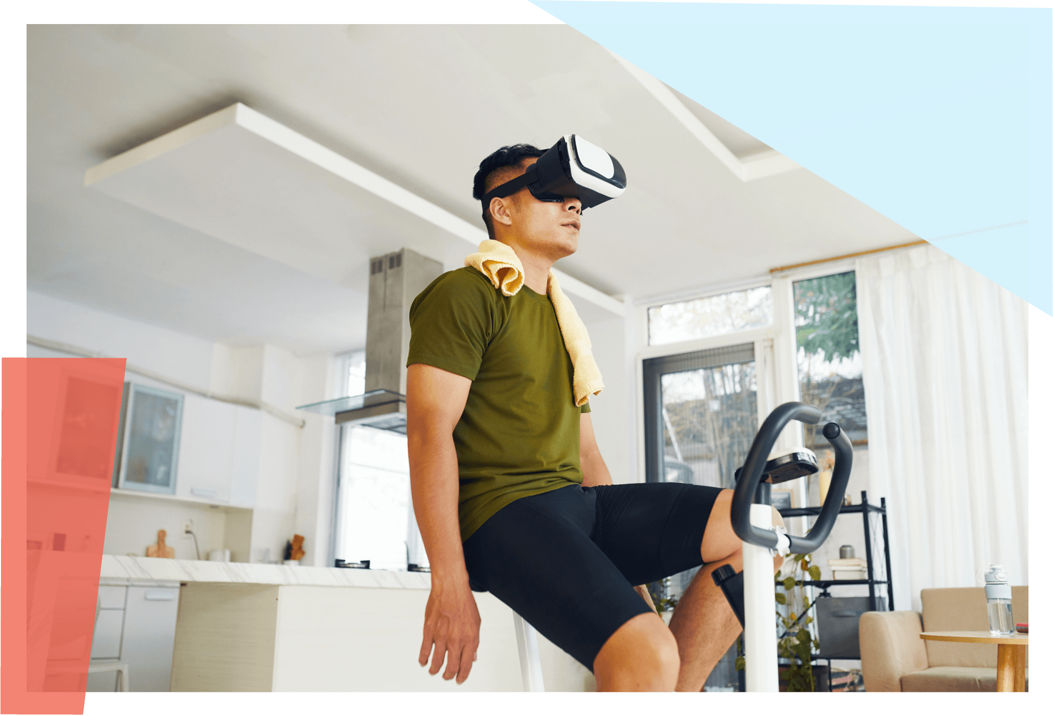 Man sitting on exercise bike while wearing a VR headset 