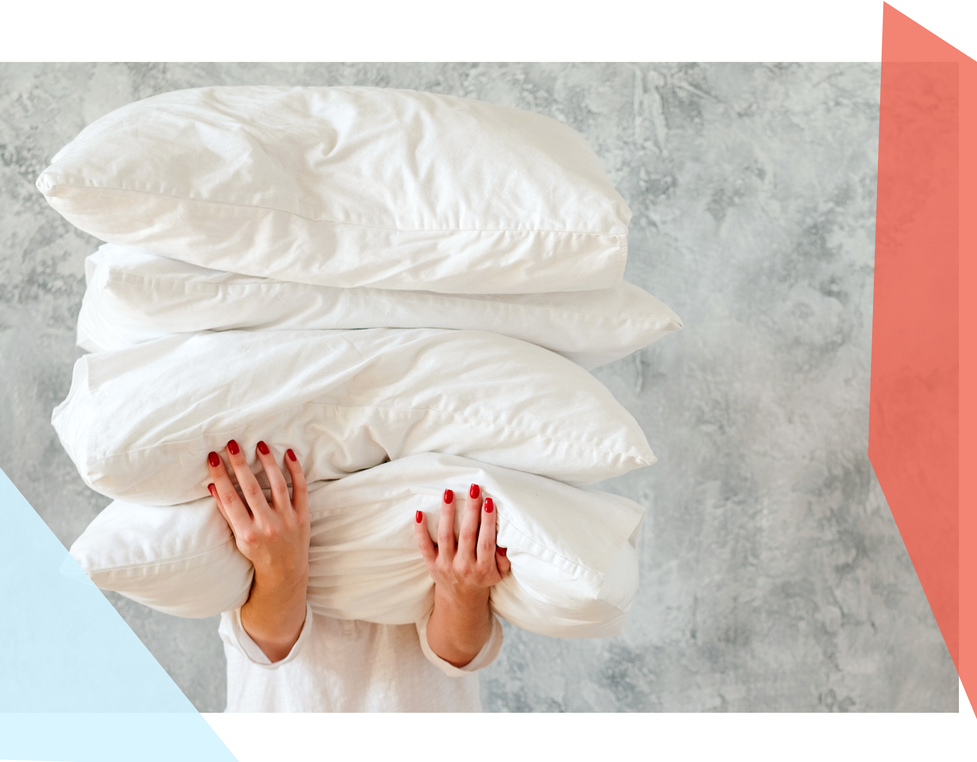 A person holding four pillows, covering their face 