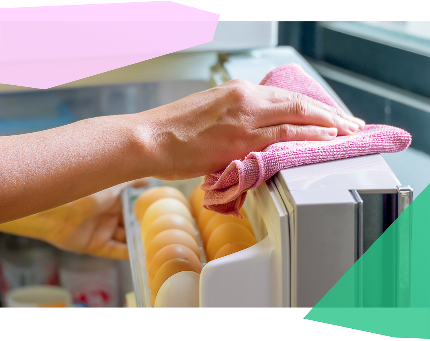 Person wiping down their fridge with a rag 