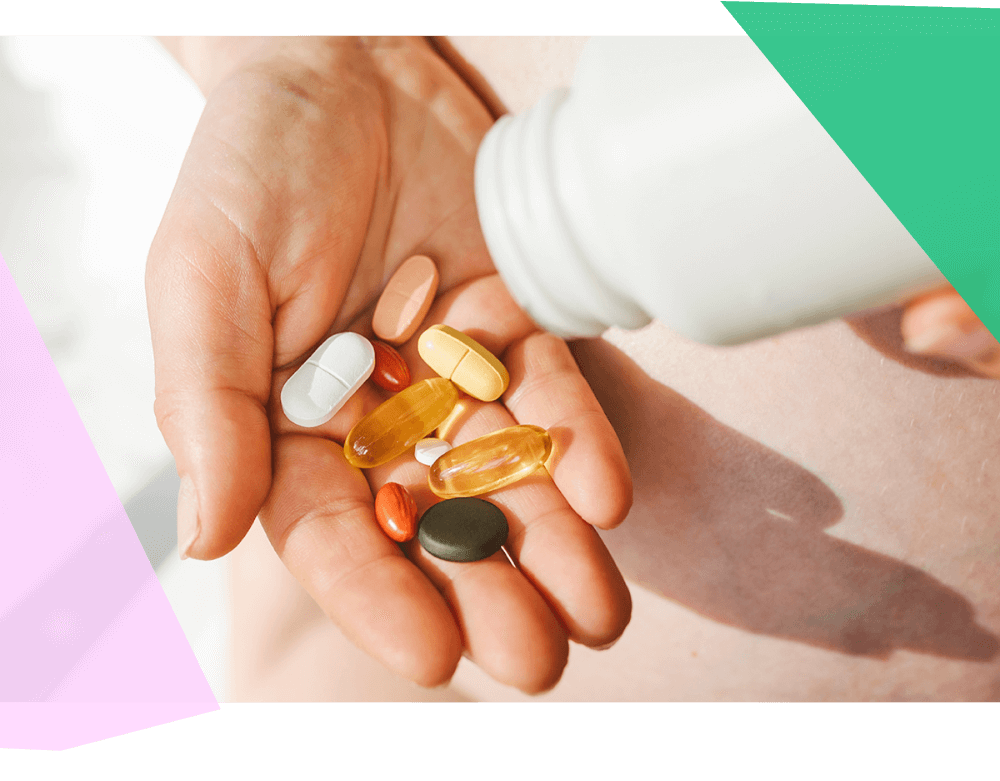 Person pouring vitamins into their palm