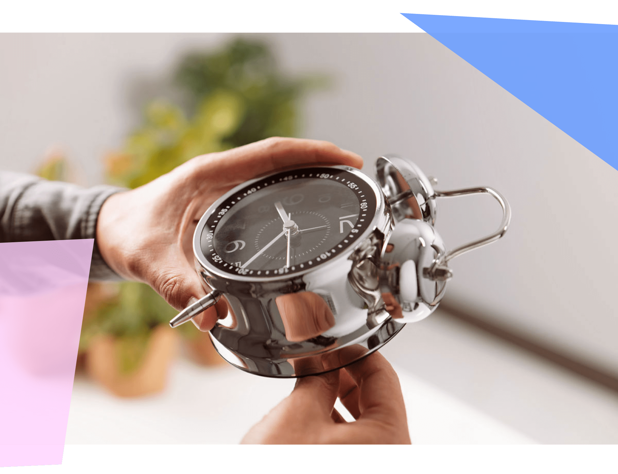 Person holding an alarm clock.