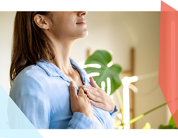 Woman with both hands on her chest 