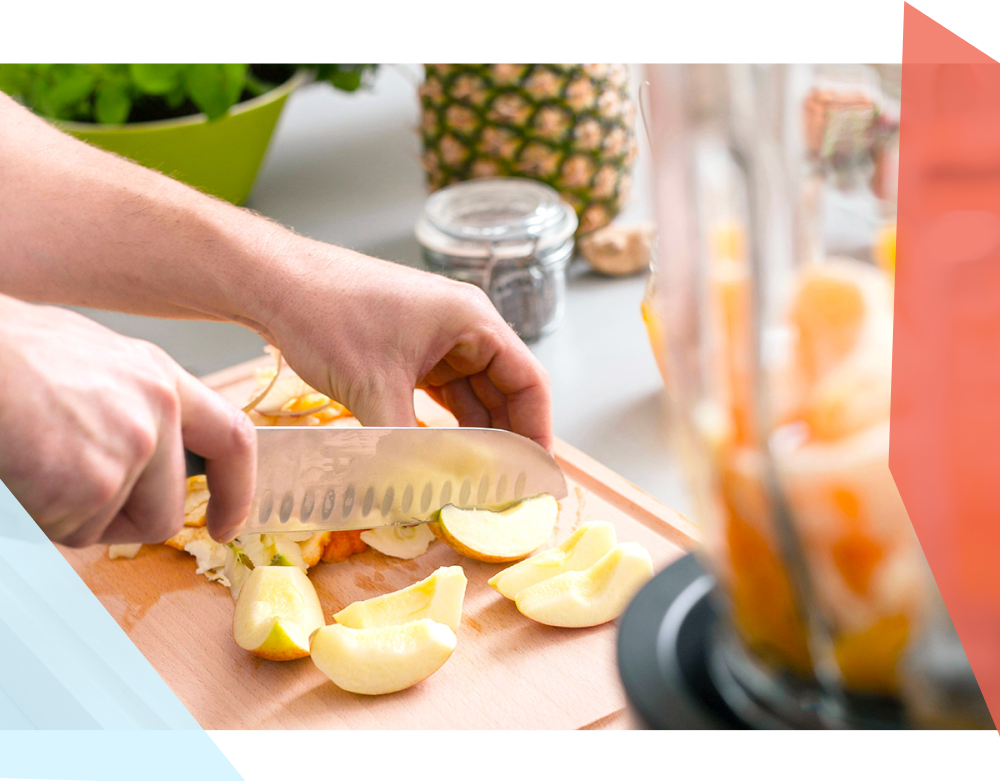 Close-up of apples being chopped on a cutting board 