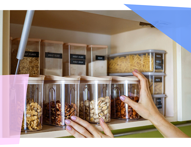 Person putting containers on a shelf. 