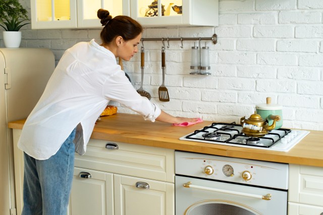 Woman cleaning kitchen