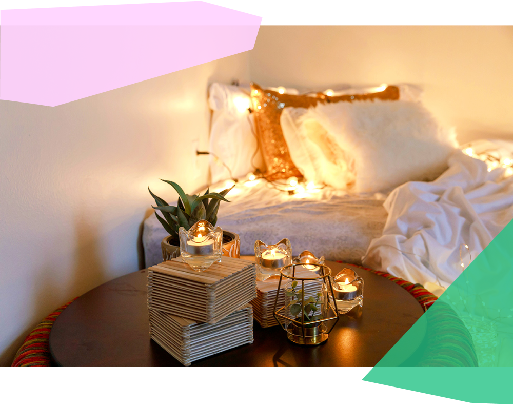 Cozy room decor with candles and string lights