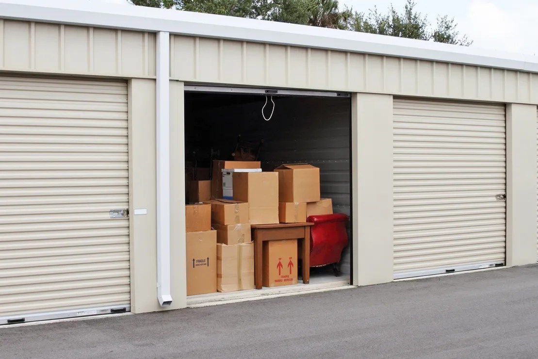 Storage unit with door open and boxes inside